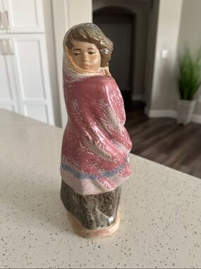 NAO by Lladro woman facing the wind wrapped up- Clay Art-